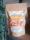 Doypack 250 g colore avana di caffè macinato aromatizzato alla nocciola Bacca Rossa.